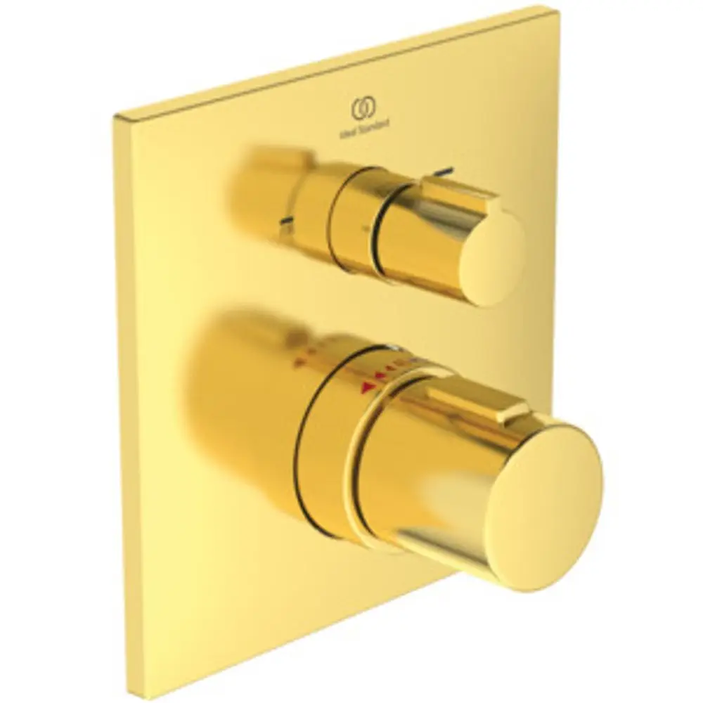 Thermostat von Ideal Standard in Goldoptik mit zwei Drehreglern zur Temperatur- und Funktionssteuerung, montiert auf einer quadratischen Plattierung.